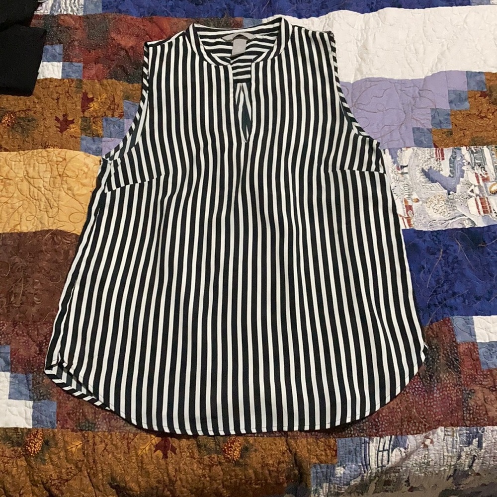 Sleeveless white and black striped blouse